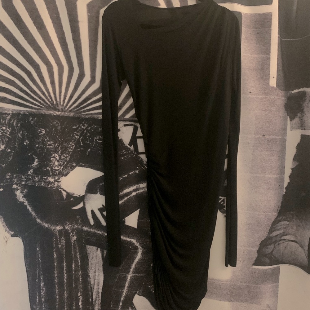 Cheryl Herger long sleeve black asymmetrical ruched dress.